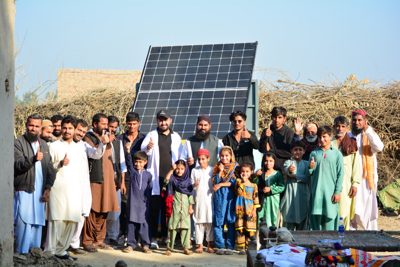 An OASIS Box handed over to a community, with its solar array